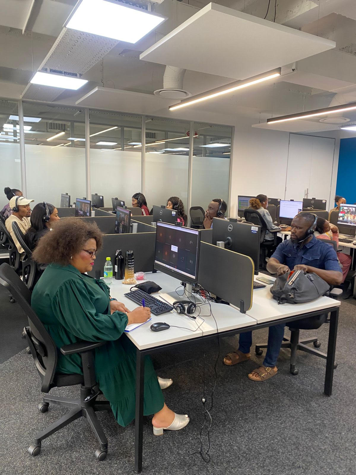 Spero team members working at rows of desks on the SDR floor