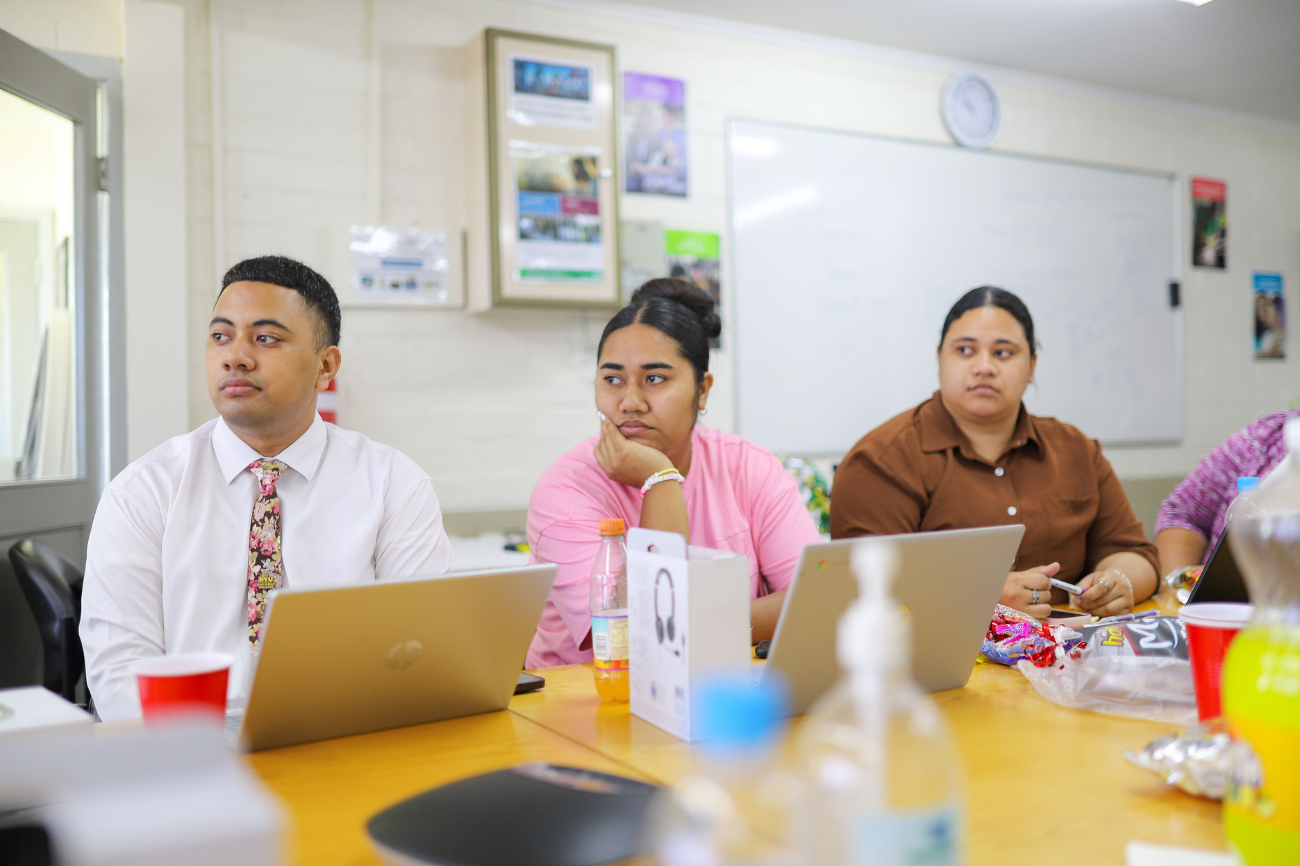 Spero Ready trainees at a table with laptops during a training session