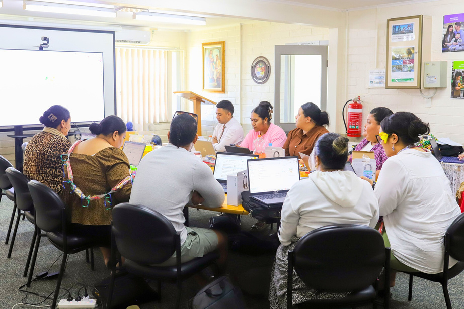 Spero Ready trainees in a classroom in Tonga working on laptops